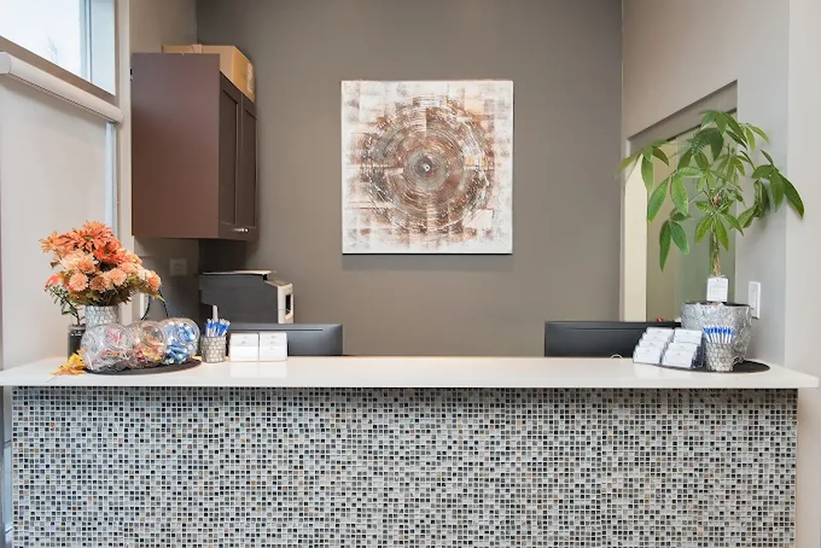 Reception desk inside Sierra Springs Dental at 2821 Main Street South #103 in Airdrie, Alberta