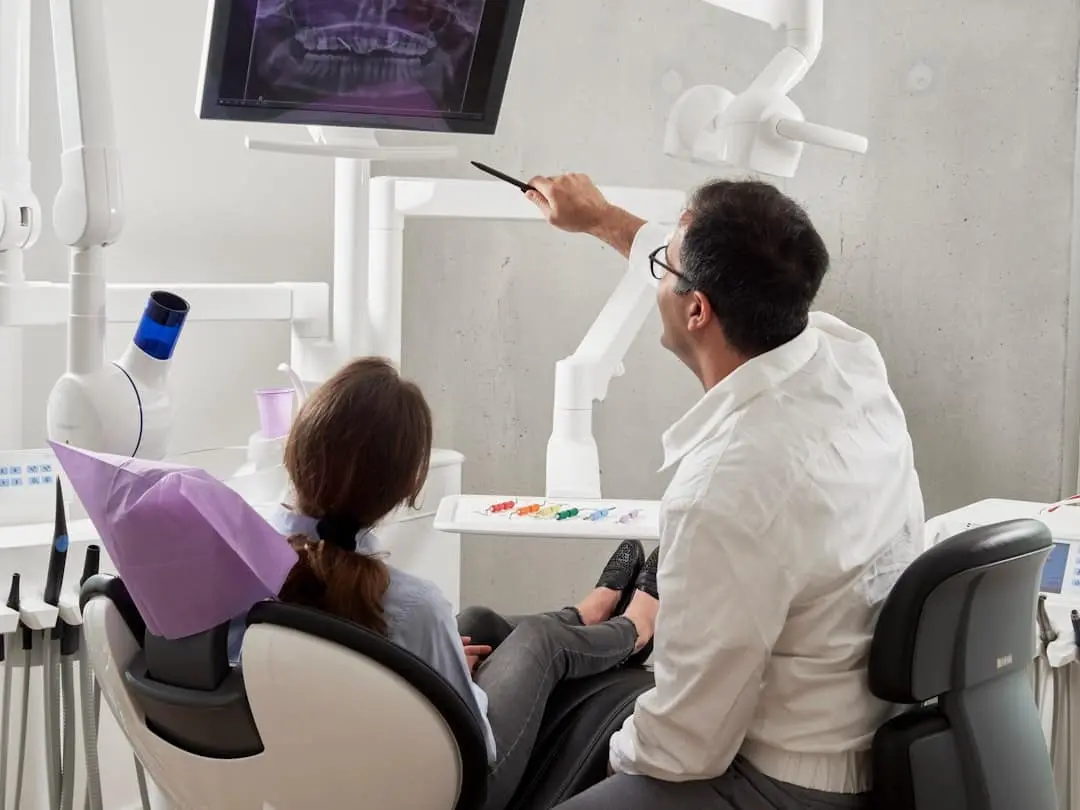 Patient discussing jaw pain during a TMJ consultation at Sierra Springs Dental in Airdrie