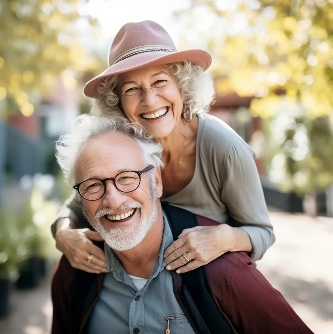 Senior couple smiling confidently with natural-looking dentures